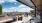 rooftop patio with seating and view of the city