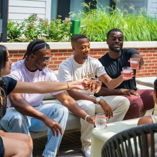friends sitting outside with drinks